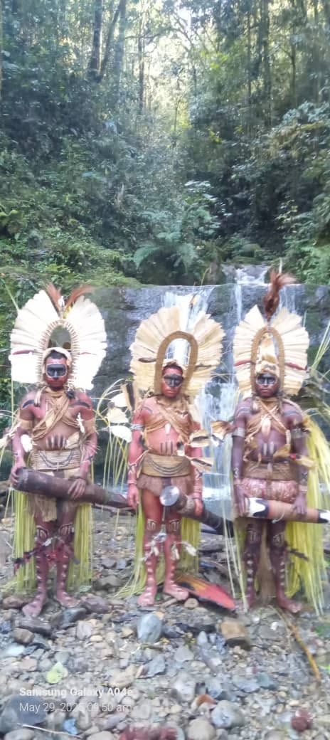 Traditional warriors by waterfall